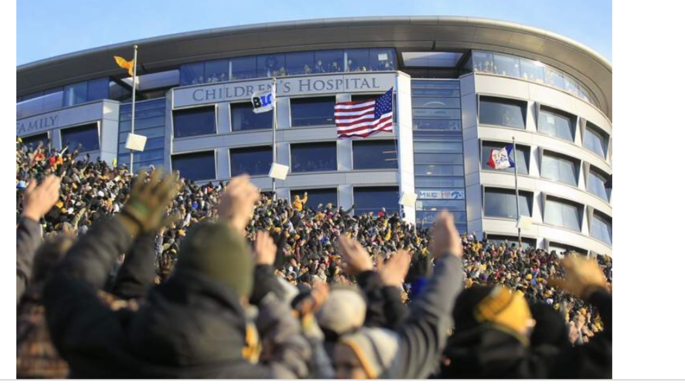 People waving to the patients at Iowa Children's Hospital