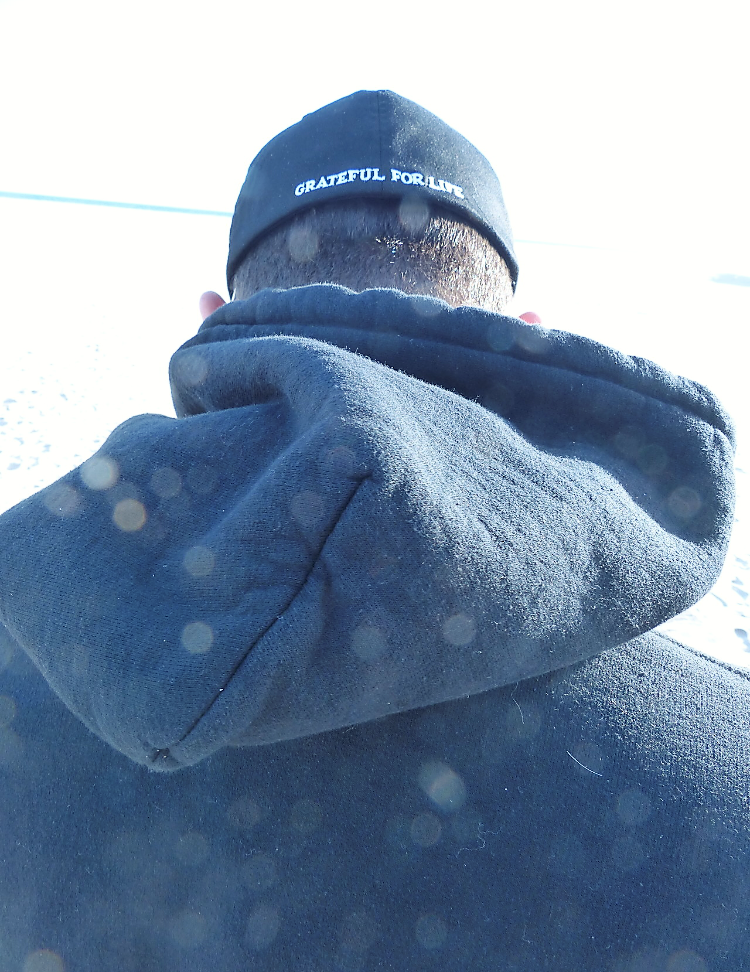 Man, facing away from the camera, wearing a GFL hat