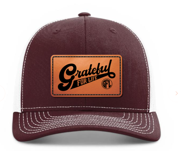 Maroon cap with a brown leather patch featuring 'Grateful For Life' text on a white background